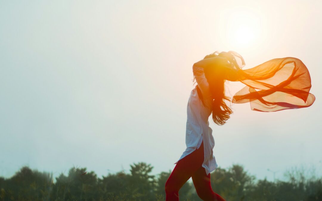 woman spreading hair at during sunset